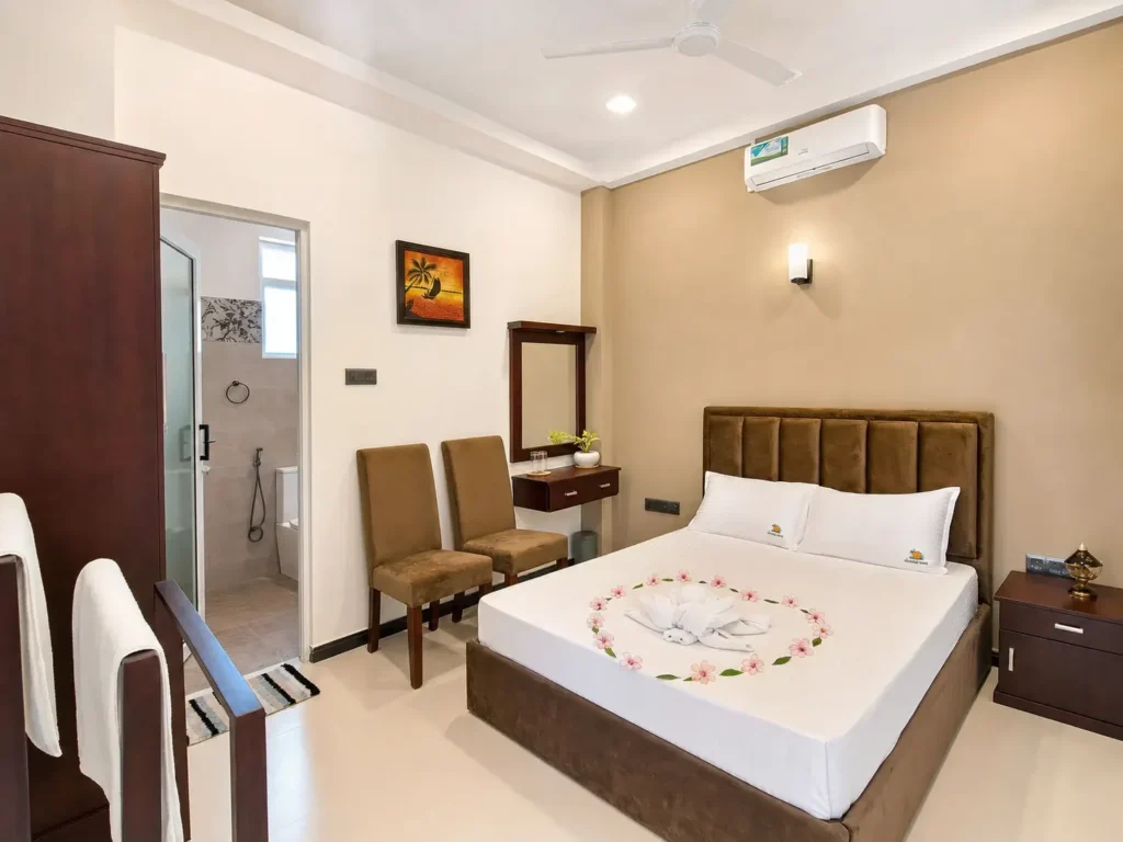 Double-room interior with air conditioning and bedside seating