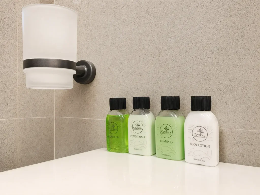 Bottled toiletries on a bathroom shelf