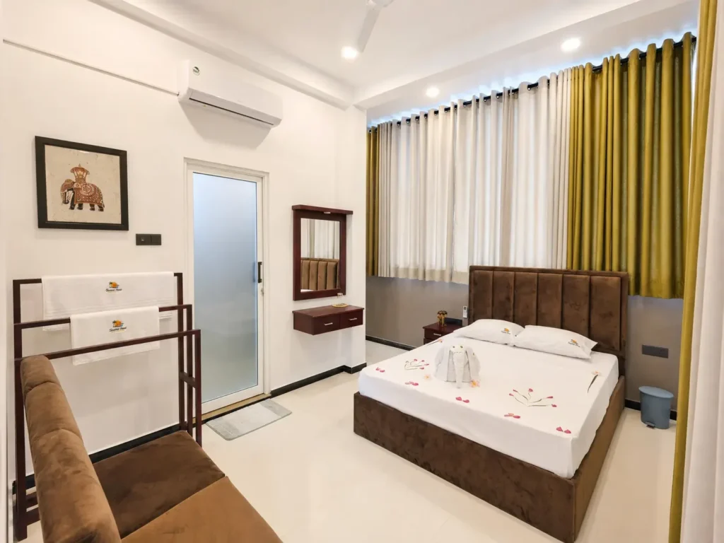 Triple-room interior with bed, curtains and seating
